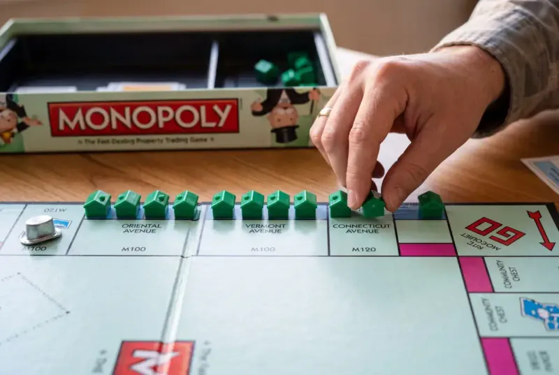 Player using the housing shortage strategy under official monopoly rules house buying